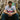 Lifestyle shot of a model sitting on stairs wearing the Maradona X COPA Napoli 1986 - 87 Away Retro Football Shirt.