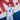 Man wearing a retro Nacional football shirt with Volkswagen sponsor, standing against a red, white, and blue mural wall.