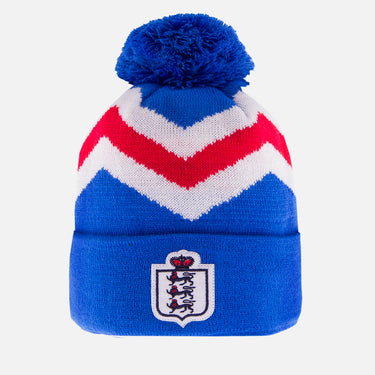 Blue beanie with red and white chevron pattern, pom-pom on top, and crest on the cuff