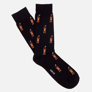 casual green socks with a repeating pixel-style illustration of a guillit holding a trophy above his head refers to holland 1988