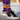 model wearing casual purple socks with pattern of keeper shirt jorge campos