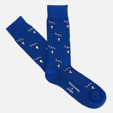casual blue socks with a repeating pixel-style illustration of maradona