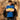 A model wearing the Maradona x COPA Boca Embroidery Polo Shirt, standing in front of a textured wall.
