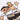 Detailed view of the mascots’ faces and outfits, emphasizing their playful expressions and classic Germany kit.