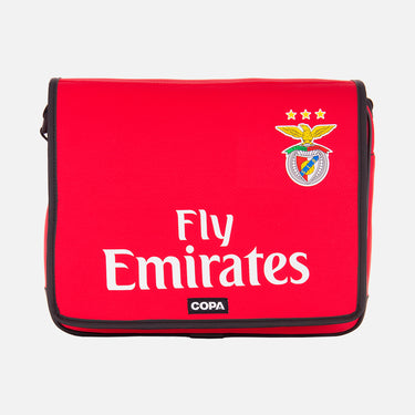 Flat-lay of the red Recycled Courier Bag featuring Fly Emirates and SL Benfica crest on the front.
