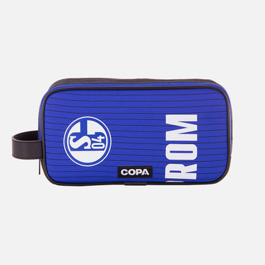 Front view of the recycled toiletry bag featuring a repurposed football shirt with a Schalke 04 badge and COPA logo
