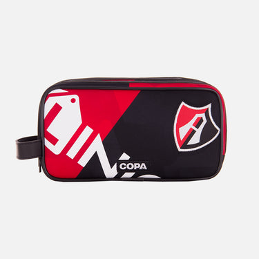Front view of the recycled toiletry bag featuring a repurposed football shirt with a Atlas badge and COPA logo