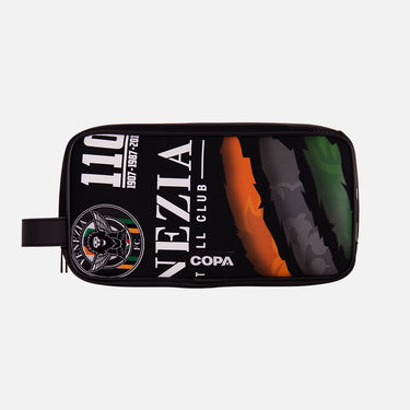 Front view of the recycled toiletry bag featuring a repurposed football shirt with a Venezia badge and COPA logo