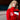 Young woman wearing the red Eintracht Frankfurt track jacket in a modern indoor setting