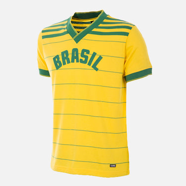 Flat-lay of the Brazil 1984 Retro Football Shirt, featuring yellow with green accents and horizontal stripes.