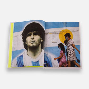 Interior spread showing street murals of football legends on urban walls