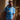 Model wearing the Maradona x COPA Napoli 1984 Retro Football Shirt, standing against a textured wall.