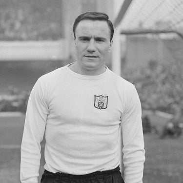 Vintage black and white photo of a Fulham player wearing the shirt
