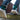 model wearing casual green socks with a repeating pixel-style illustration of eric cantona football moment kung fu