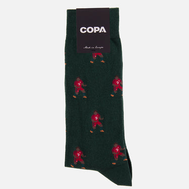 casual black socks with a repeating pixel-style illustration of a smiling german footballer white black with packaging