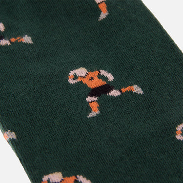 detail of casual green socks with a repeating pixel-style illustration of sneijder celebrating goal euro 2010