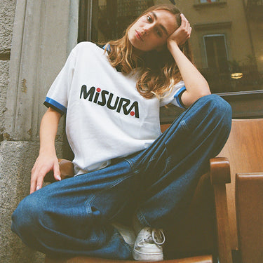 FC Internazionale 1986 Away Retro Football Shirt White & Blue Lifestyle worn by a model in a relaxed outdoor setting.