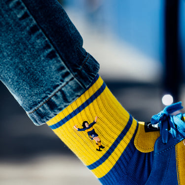 model wearing casual blue terry socks boca with maradona emboidery