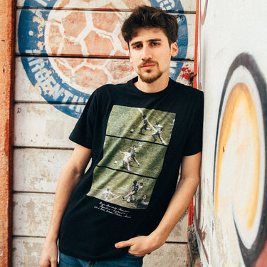 Man wearing Maradona x COPA 1986 Solo Goal T-Shirt, featuring iconic moments from Maradona’s legendary goal against England.
