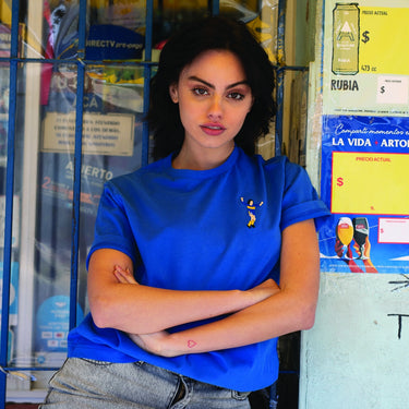 Model wearing the Maradona x COPA Boca Embroidery T-Shirt, posing in an urban setting.
