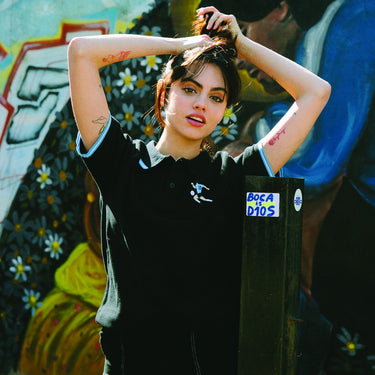 Model wearing black Maradona x COPA Argentina Embroidery Polo Shirt with white embroidered details