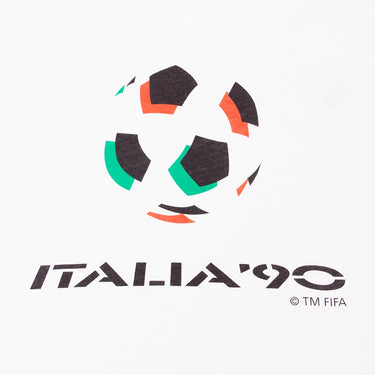 Close-up of the emblem print, showcasing the iconic black, green, and red football design with the Italia '90 text below.