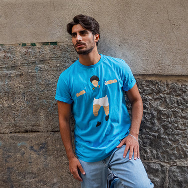 Maradona X COPA Napoli Graphic T-Shirt Blue featuring an abstract illustration of Maradona celebrating in Napoli colors.
