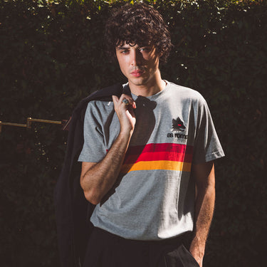 AS Roma Stripes T-Shirt Grey, Red & Yellow Lifestyle worn by a model in an outdoor setting.