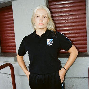 FC Internazionale Taper Polo Black Lifestyle worn by a model in a modern urban setting.