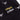 Zoomed-in view of the label and logo print details on the Panini All Over Sweater.