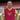 Model wearing the Dukla Prague 1960's Retro Football Shirt, posing in a stadium.