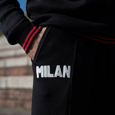 AC Milan 1960s embroidery pant worn detail showing Milan logo
