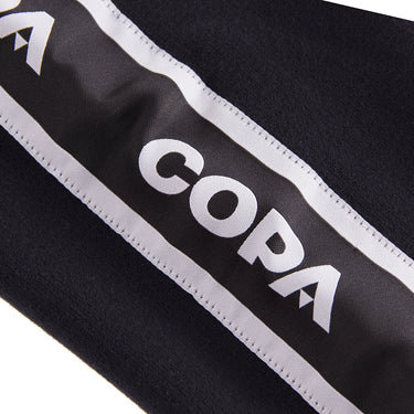 Close-up of the shoulder detailing with the "COPA" logo printed along the stripe.
