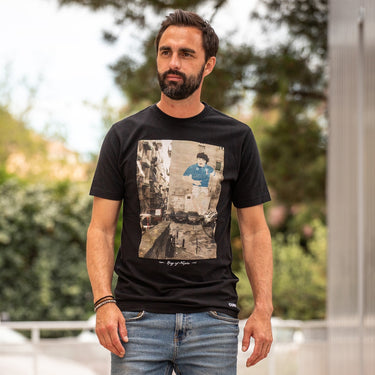 Model wearing the King of Naples T-Shirt outdoors, showcasing its fit and design.
