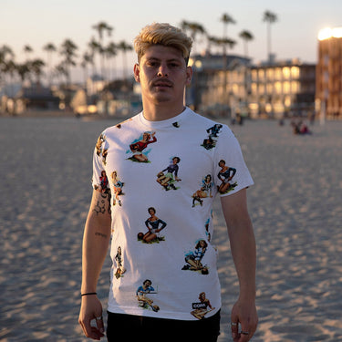 Model wearing the Calcio Donna T-Shirt on a beach at sunset.
