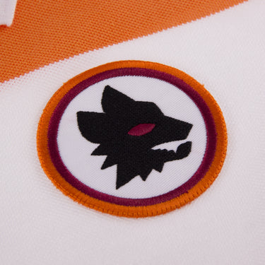 Close-up of AS Roma embroidered wolf head crest on orange and red background