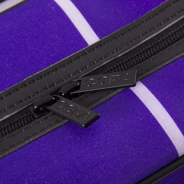 Close-up of purple fabric and black zipper.