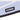 Close-up of COPA label on light grey and blue geometric patterned surface.