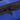 Close-up of black zipper on rich blue fabric.