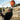Person holding COPA Retro Football 1950's with the ball above their head in an outdoor setting