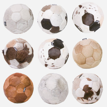 Various views of different COPA Cow Footballs showcasing unique patterns of the cowhide