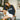 Young woman wearing the navy blue Inter Milan sweatshirt while sitting indoors
