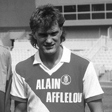 Black and white image of a Monaco player wearing the 1987-88 retro football shirt during a past match.